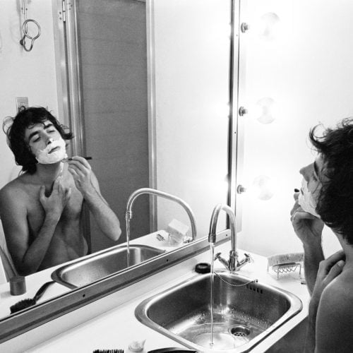 Joan Manel Serrat shaving in his dressing room